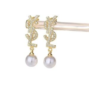 Stainless steel YSL shaped gold plated diamond earrings